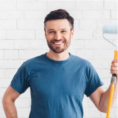 happy-man-preparing-for-paint-new-apartment-walls-2021-08-30-02-11-38-utc